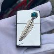 Zippo bạc bóng lông vũ đá quý